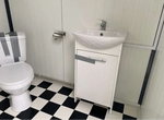 Contenedor sanitario 4X2M inodoro doble con duchas